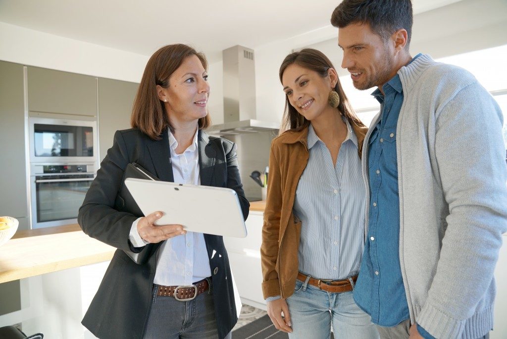 couple checking home features as they prepare to purchase a home