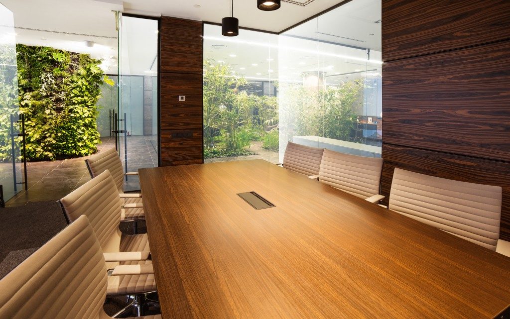 office space with meeting room and plants