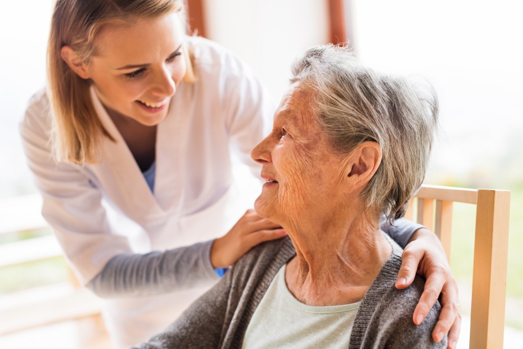 senior with her nurse