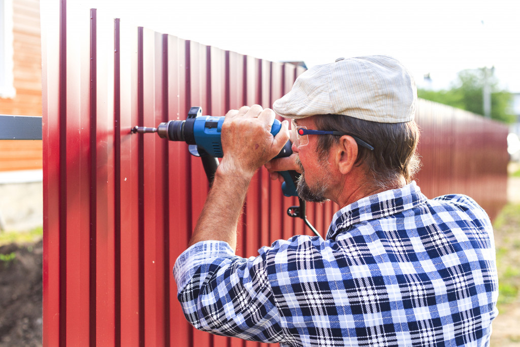 a man fixing a fence