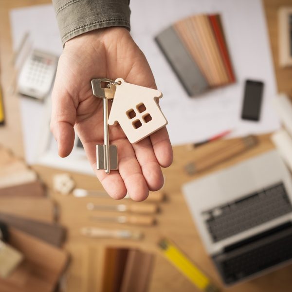 real estate agent handing over house key