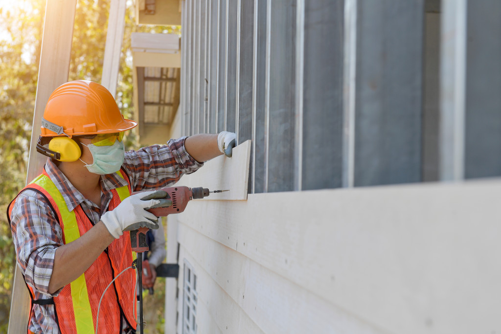 man installing walls