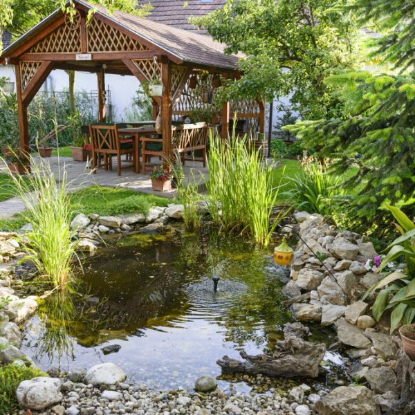 private oasis in the backyard with seating area and water feature