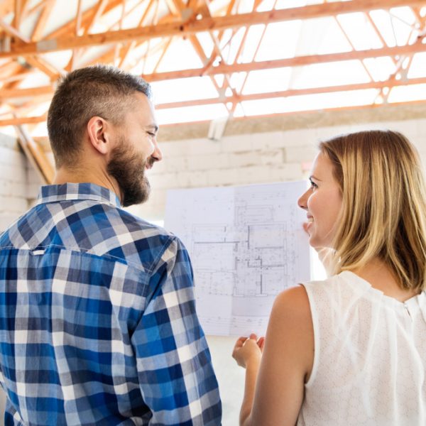 couple visiting the project site of their home